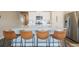 Kitchen with white cabinets, stainless steel appliances, and a large island with bar stool seating at 2159 Indian Balsam Dr, Monument, CO 80132