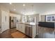 Bright kitchen with stainless steel appliances, a center island and open floor plan at 2159 Indian Balsam Dr, Monument, CO 80132
