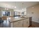Kitchen with white cabinets, a dining area, and a view into the living room at 2159 Indian Balsam Dr, Monument, CO 80132