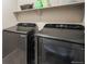 Laundry room with modern washer and dryer at 2159 Indian Balsam Dr, Monument, CO 80132