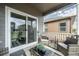 Cozy covered patio with wicker seating, string lights, and access via sliding glass door at 2159 Indian Balsam Dr, Monument, CO 80132