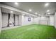 Bright recreation room with artificial turf, perfect for sports or play at 2159 Indian Balsam Dr, Monument, CO 80132