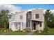 Attractive new two-story townhome featuring a partial brick facade and modern architectural details at 24108 E Warm Springs Ave, Aurora, CO 80019