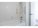 This bathroom includes a showerhead over a tub at 8463 Everett Way # B, Arvada, CO 80005