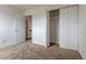 This bedroom includes a closet and access to other rooms at 8463 Everett Way # B, Arvada, CO 80005