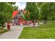 Community playground showcasing the vibrant play structure and surrounding green space at 8463 Everett Way # B, Arvada, CO 80005