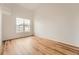Bright bedroom featuring wood floors, neutral walls and a large window offering great natural light at 3872 S Dallas St # 7-304, Aurora, CO 80014