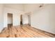 This bedroom has wood-look flooring and neutral paint, offering a calming space at 3872 S Dallas St # 7-304, Aurora, CO 80014