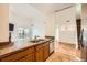 Open-concept kitchen features granite countertops, stainless steel appliances, and wood cabinets at 3872 S Dallas St # 7-304, Aurora, CO 80014