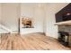 Open-concept layout seamlessly integrates living, dining, and kitchen with staircase and fireplace at 3872 S Dallas St # 7-304, Aurora, CO 80014