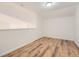 This room has wood-look flooring and neutral walls at 3872 S Dallas St # 7-304, Aurora, CO 80014
