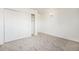 Bright bedroom features a large closet with sliding doors and neutral carpeting at 1113 W 112Th Ave # B, Denver, CO 80234