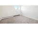 Carpeted bedroom featuring natural light and white walls at 1113 W 112Th Ave # B, Denver, CO 80234