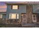 Charming two-story home featuring blue siding and stone accents at 1113 W 112Th Ave # B, Denver, CO 80234