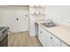 Modern kitchen with white cabinets, stainless steel appliances, and light countertops at 1113 W 112Th Ave # B, Denver, CO 80234