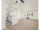 Open living room and kitchen with laminate wood floors at 1113 W 112Th Ave # B, Denver, CO 80234
