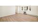 Bright living room with wood-look floors and a large bay window offering lots of natural light at 1113 W 112Th Ave # B, Denver, CO 80234