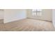 Neutral bedroom featuring carpeted floors and a window providing natural light at 6740 Juniper Dr, Thornton, CO 80602
