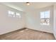 Cozy bedroom with neutral carpet, bright windows, and ample natural light at 6740 Juniper Dr, Thornton, CO 80602
