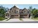 Beautiful two-story townhome with neutral siding, double garage, and well-manicured landscaping at 6740 Juniper Dr, Thornton, CO 80602