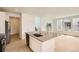 Bright, modern kitchen with stainless steel appliances, island, and light wood floors at 6740 Juniper Dr, Thornton, CO 80602