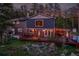 Outdoor living space with a large deck, patio heater and backyard at 4574 Picutis Rd, Indian Hills, CO 80454