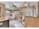 Luxurious bathroom with a soaking tub, walk-in shower, and elegant tile, and natural light at 4574 Picutis Rd, Indian Hills, CO 80454