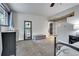 Comfortable carpeted bedroom with a large mirror, dresser, and access to other rooms at 4574 Picutis Rd, Indian Hills, CO 80454