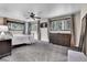 Spacious bedroom with large windows, carpet, and ample natural light, perfect for relaxation at 4574 Picutis Rd, Indian Hills, CO 80454