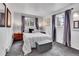 Cozy bedroom with a comfortable bed, neutral tones, and natural light creating a relaxing retreat at 4574 Picutis Rd, Indian Hills, CO 80454