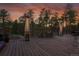 Large patio with outdoor heater and small table and chairs at 4574 Picutis Rd, Indian Hills, CO 80454