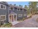 Charming two-story home with a covered front porch and well-manicured landscaping at 4574 Picutis Rd, Indian Hills, CO 80454
