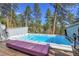 Outdoor hot tub with a scenic wooded view, perfect for relaxing and unwinding at 4574 Picutis Rd, Indian Hills, CO 80454