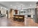 The living room features a stone fireplace, hardwood floors, and plenty of natural light at 4574 Picutis Rd, Indian Hills, CO 80454