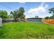 Enjoy the expansive backyard with a new fence, luscious grass, and plenty of room for activities at 1440 S Clermont St, Denver, CO 80222