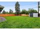 Large green backyard featuring a new fence and shed offering both privacy and plenty of storage at 1440 S Clermont St, Denver, CO 80222