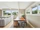 Dining room area featuring a large table and bright windows with neighborhood views at 1440 S Clermont St, Denver, CO 80222