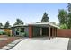 Charming single-story home with gray siding, carport, and modern landscaping at 1440 S Clermont St, Denver, CO 80222