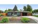 Charming single-story home featuring a well-maintained yard and unique carport at 1440 S Clermont St, Denver, CO 80222