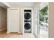 Conveniently located, this laundry area features a stackable washer and dryer unit with outside access at 1440 S Clermont St, Denver, CO 80222