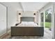 Large bedroom featuring a sliding glass door and hardwood flooring at 1440 S Clermont St, Denver, CO 80222