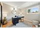 Bright office with a black desk, modern lamp, and neutral decor at 1440 S Clermont St, Denver, CO 80222