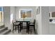 This dining area is great for entertaining with natural light and neutral paint at 4835 Grove St, Denver, CO 80221