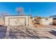 Detached two car garage and private drive way to side door of the home at 4835 Grove St, Denver, CO 80221
