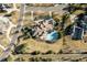 Overhead aerial shot highlighting the property's layout, including the pool, patio, and surrounding greenery at 4041 E Forbes Ct, Greenwood Village, CO 80121