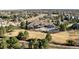 Wide aerial perspective showcasing the property's extensive backyard, pool, and a pergola with neighborhood views at 4041 E Forbes Ct, Greenwood Village, CO 80121