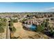 High aerial view showing the pool, patio, and lush backyard of an estate in an upscale neighborhood at 4041 E Forbes Ct, Greenwood Village, CO 80121