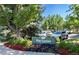Community center entrance featuring well-maintained landscaping and a sign, providing a welcoming atmosphere for residents at 4041 E Forbes Ct, Greenwood Village, CO 80121
