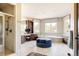 Luxurious bathroom featuring a large vanity, soaking tub, glass shower, tile flooring, and linen closet at 4041 E Forbes Ct, Greenwood Village, CO 80121