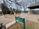 Community play area featuring slides, playground equipment, and seating under a gazebo, promoting a safe and fun environment at 4041 E Forbes Ct, Greenwood Village, CO 80121